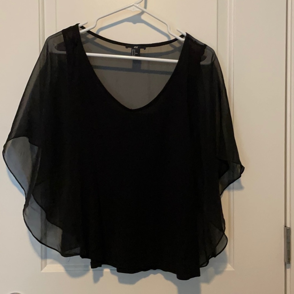 Black top with translucent sleeves